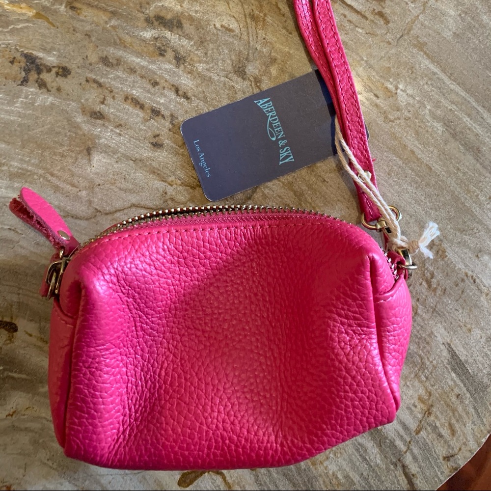 Hot pink leather wristlet.